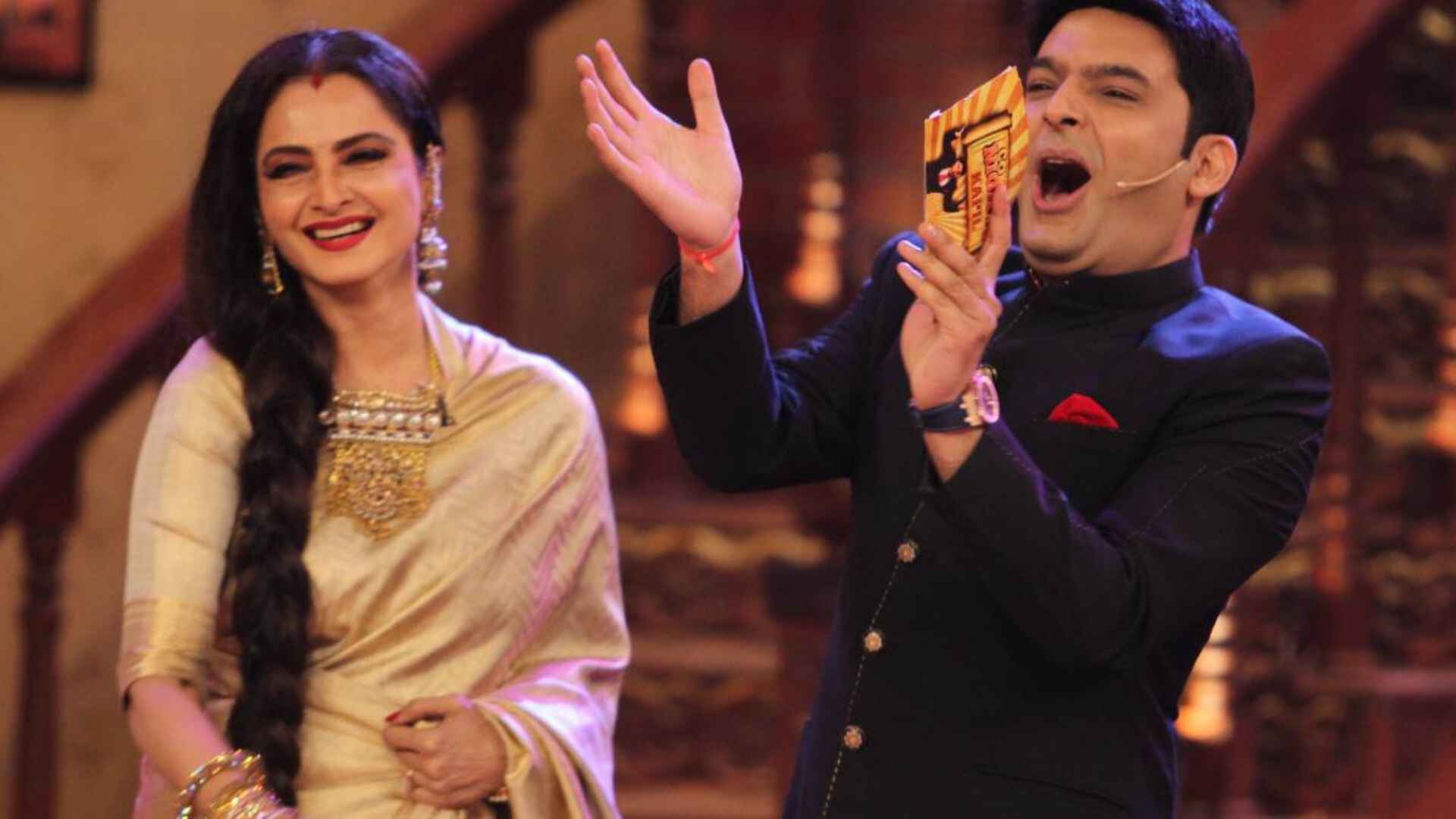 Kapil Sharma Imitates Amitabh Bachchan, Rekha’s Priceless Response: ‘Mujhse Puchiye Na…’ | Watch